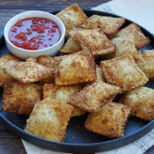 Breaded ravioli with red sauce