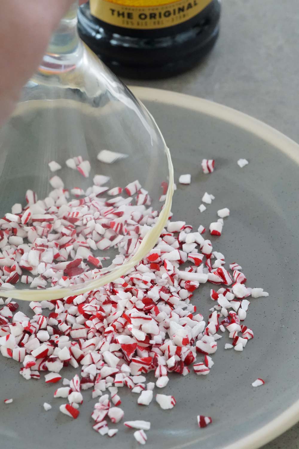 rimming glass with peppermint pieces