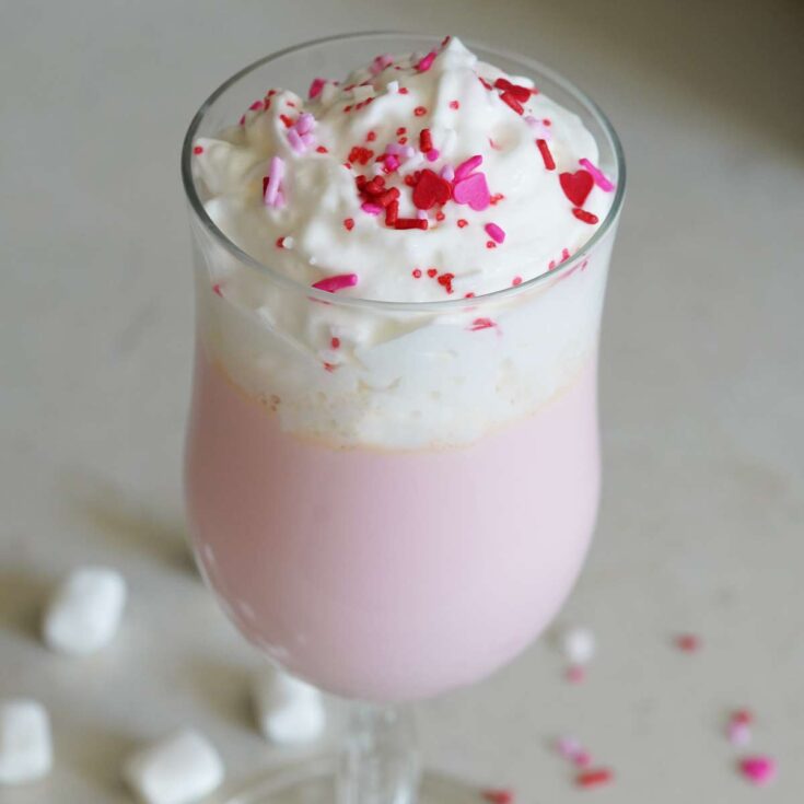 A glass of pink hot chocolate