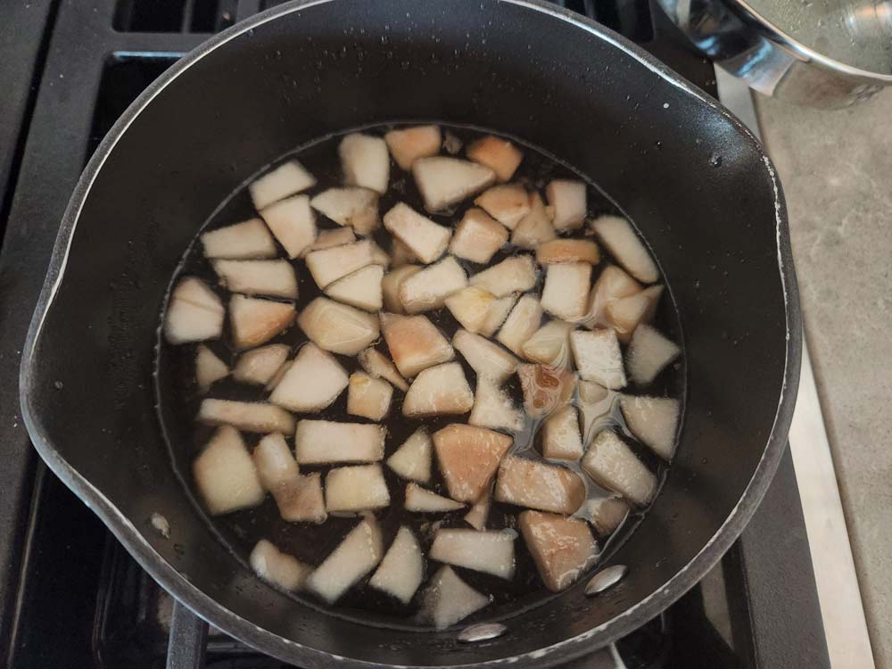 cooking down pear simple syrup in a saucepan