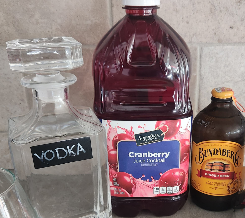 Ingredients for a cranberry ginger beer cocktail