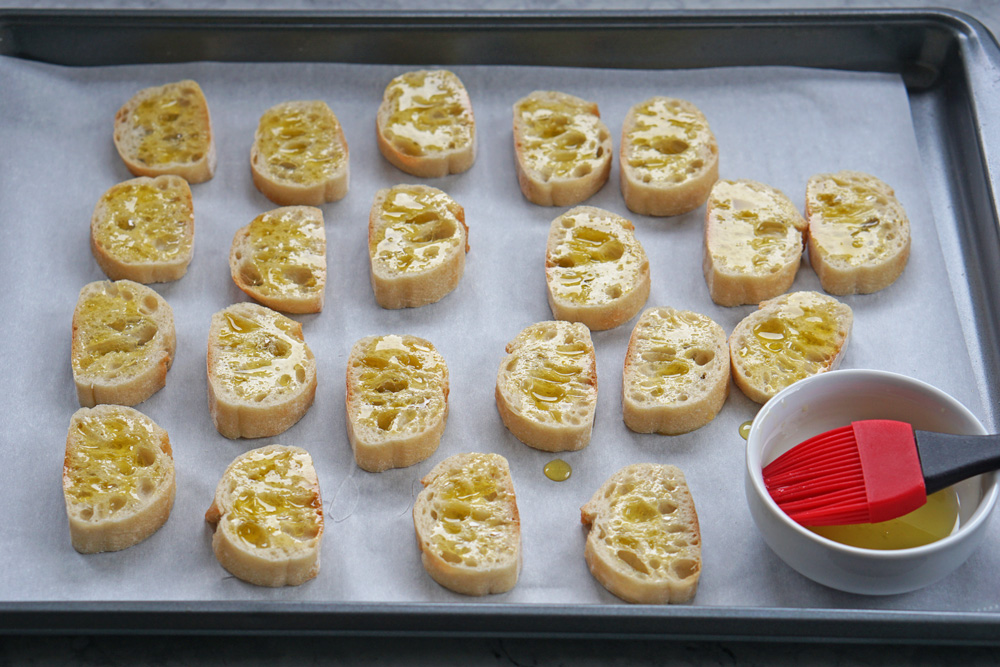 toasting the bread with olive oil