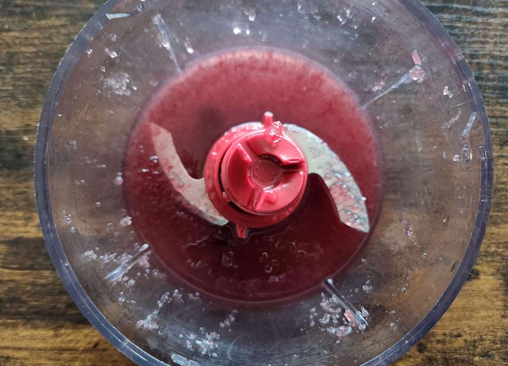 blending the cherries in the food processor.