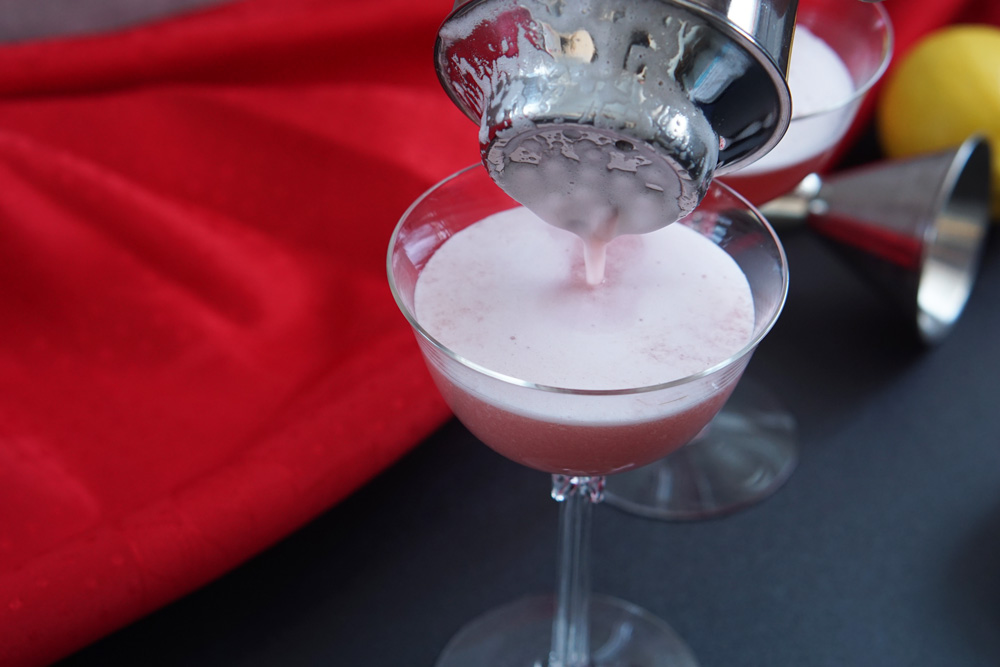 Pouring a Cupid's crush cocktail