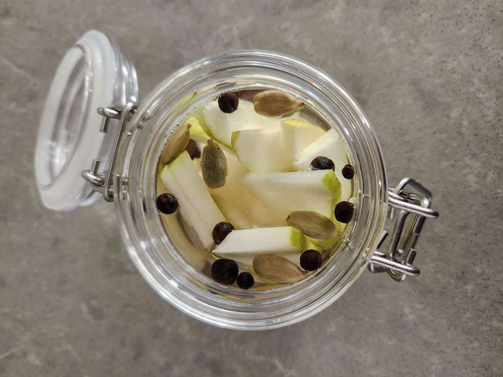 All the ingredients in a jar to infuse the rum