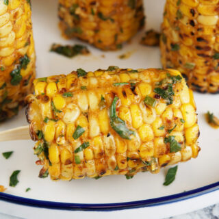 Corn lollipops with cowboy butter