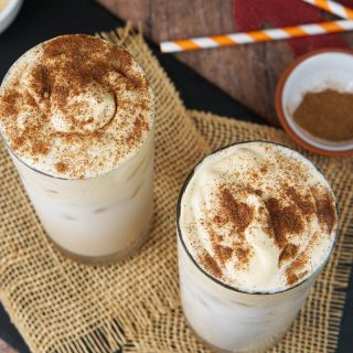 Iced chai latte with pumpkin spice cream